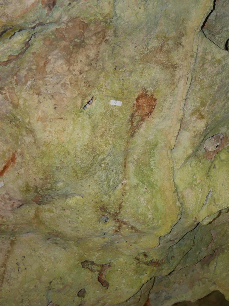 Painting of a person holding a leaf kite